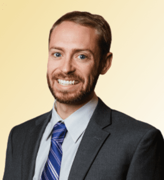 David Messinger man smiling, wearing a suit and tie