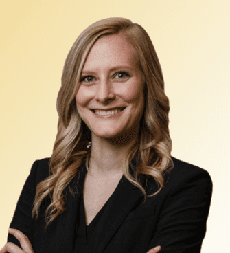 Susan Hose woman smiling, wearing a black suit