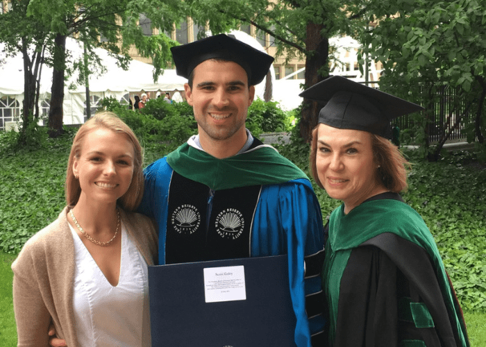 galey 1 A man and two women standing in graduation gear