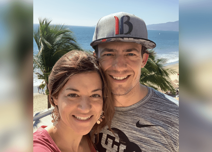 peterson 3 A man and a woman taking a selfie on a beach