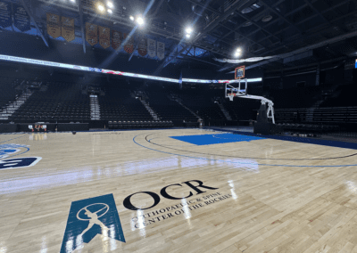 The OCR logo on the basketball court