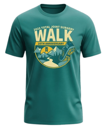 shirt - Edited Green t-shirt with a graphic showing a trail, trees, and a shoe print. Text reads “2025 Total Joint Surgery Walk, 20th Anniversary” in yellow and cream colors.