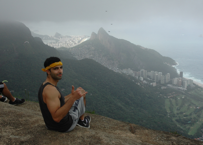 Dr. Robert Matar sitting at the top of Pedra Bonita in Rio de Janeiro